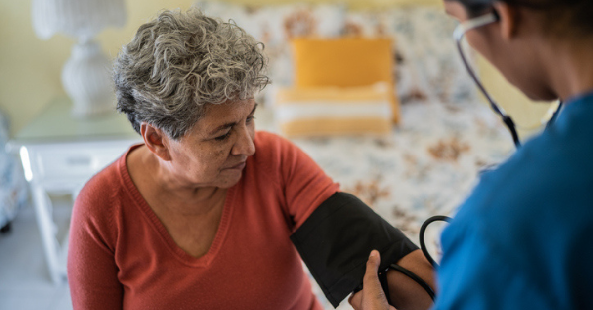 Woman getting her blood pressure checked