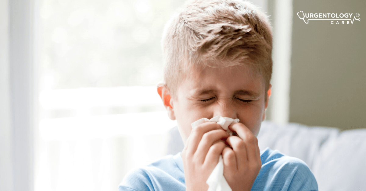child blowing his nose